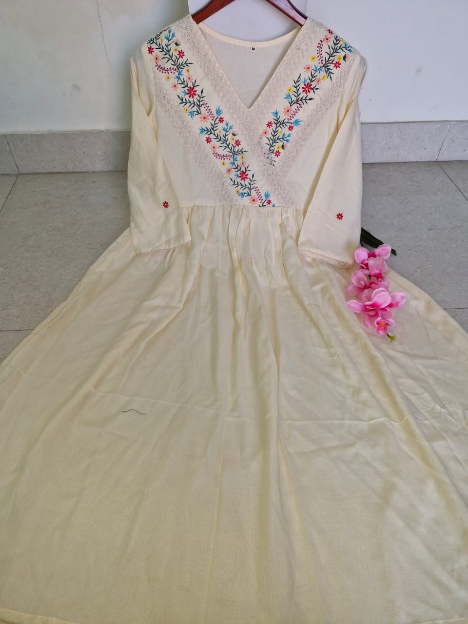 Detailing with floral embroidery on yoke and sleeves